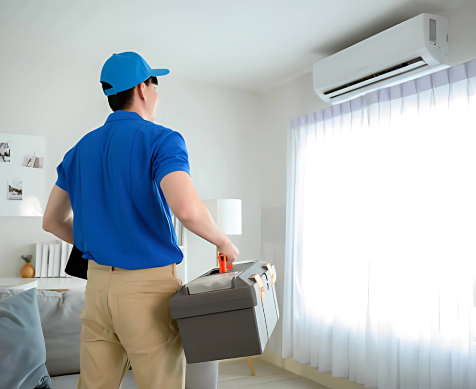 Technician working on an outdoor AC unit